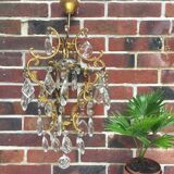 Old chandelier has tassels