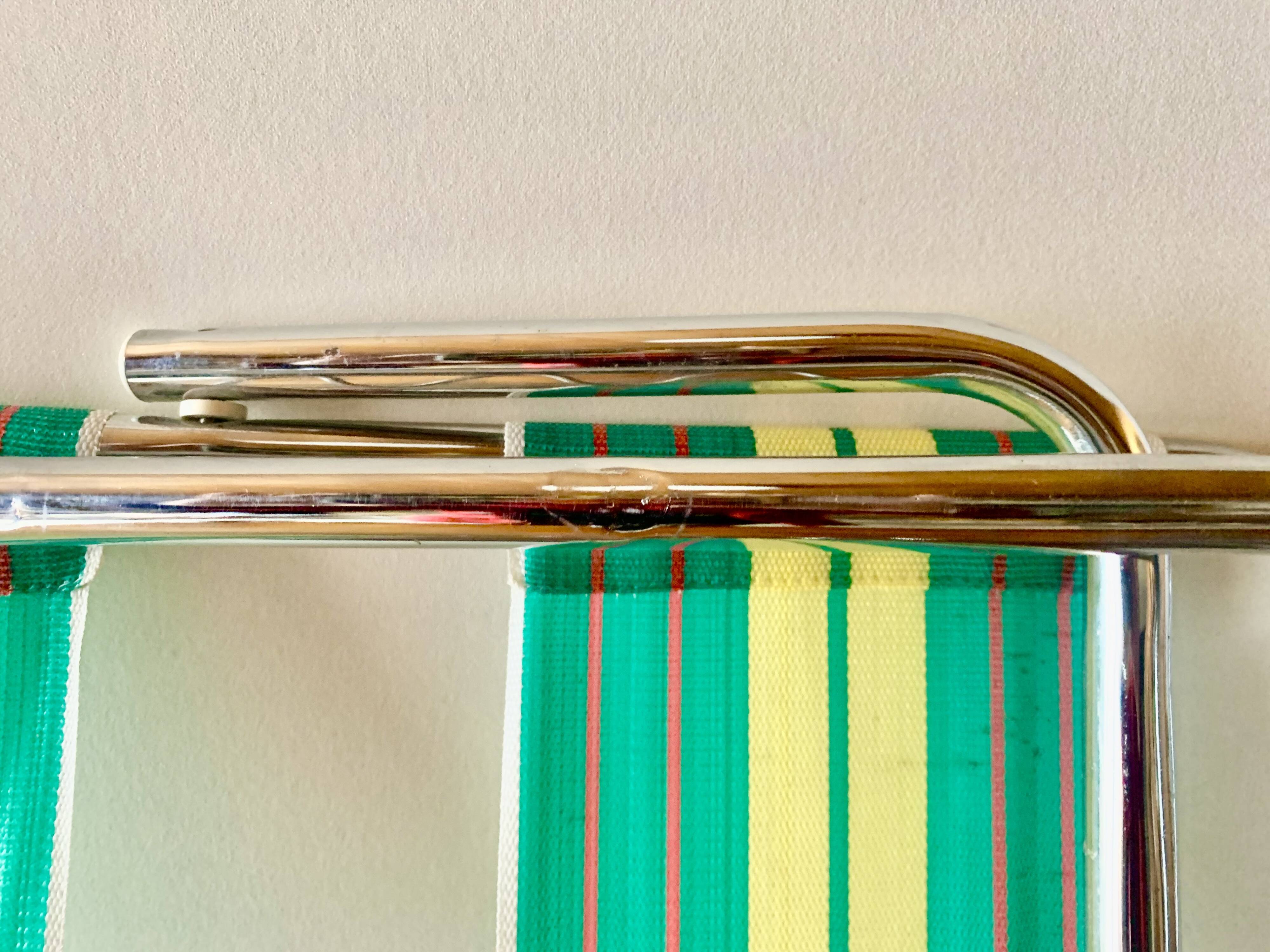 Vintage folding beach chair in chrome metal and woven plastic
