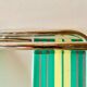 Vintage folding beach chair in chrome metal and woven plastic