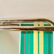 Vintage folding beach chair in chrome metal and woven plastic