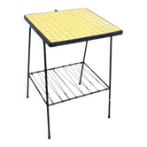 Small vintage yellow side table with magazine rack.