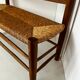 Old wooden and straw bench