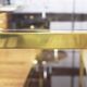 Brass console and smoked glass