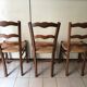 Wooden and straw chairs