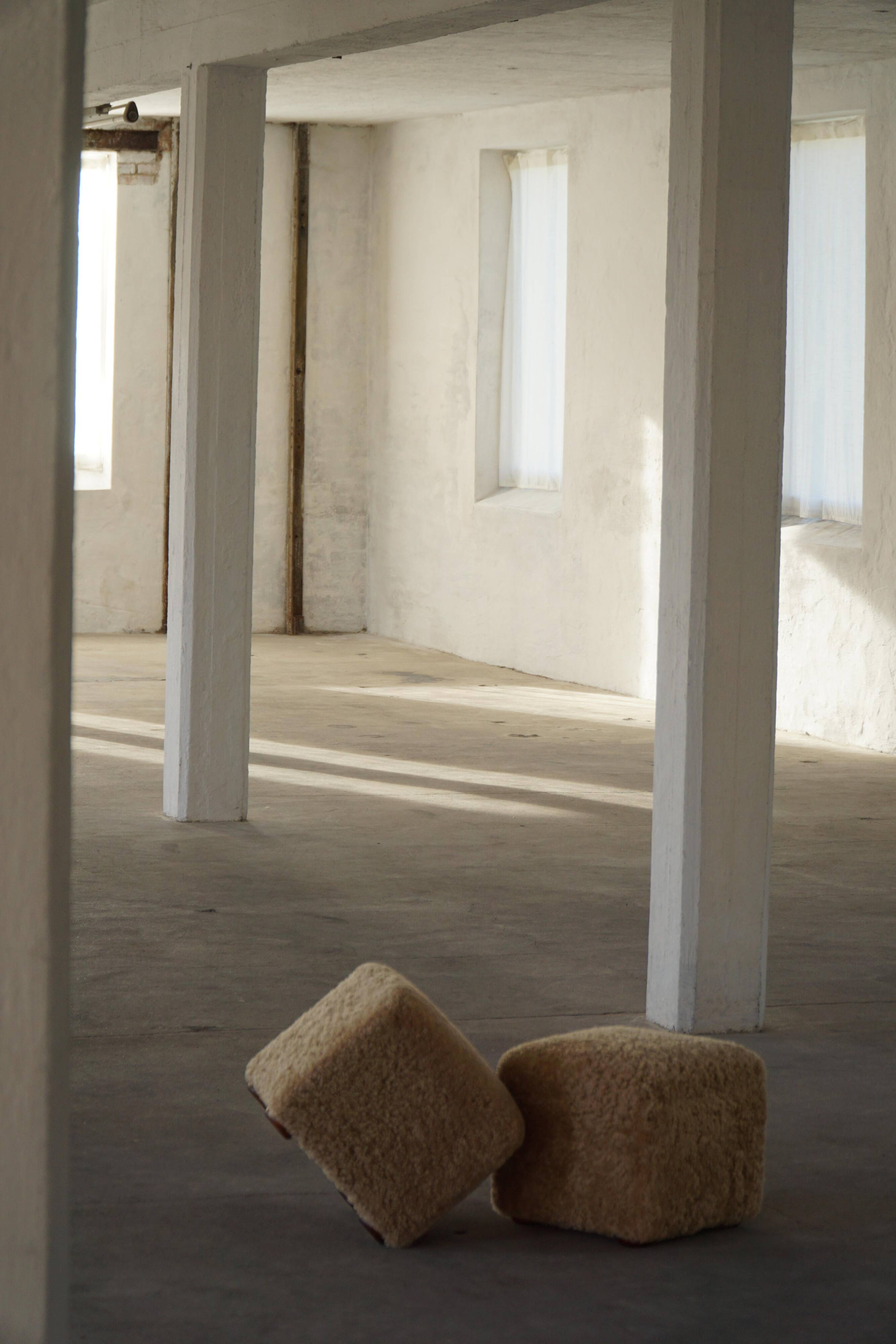 French mid-century cube poufs, a pair of lambswool stools, 1960s.