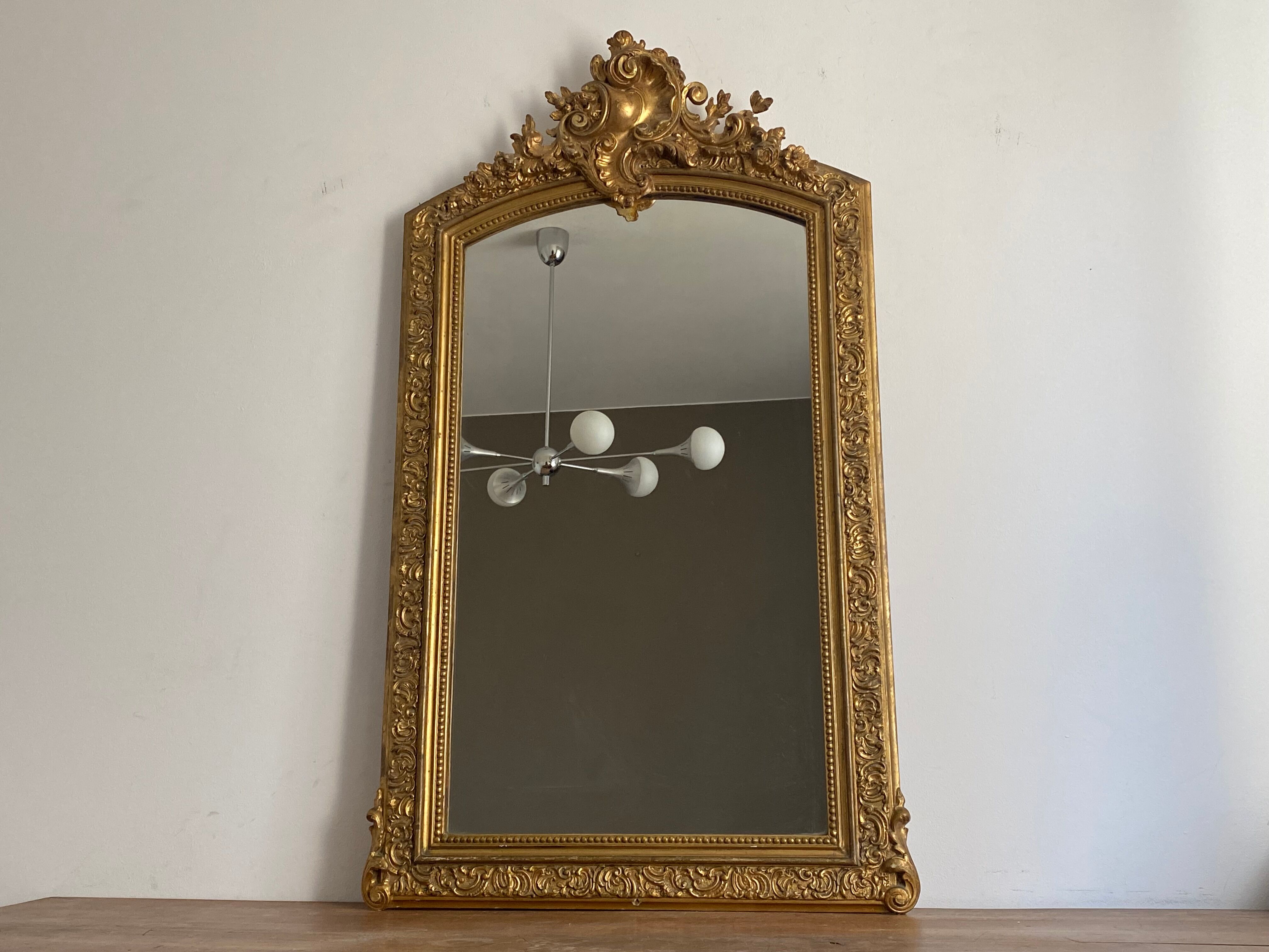 Late 19th century gilded mirror with decorated pediment 125x70cm