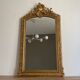 Late 19th century gilded mirror with decorated pediment 125x70cm