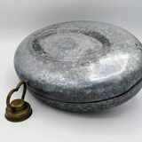 Old metal hot water bottle