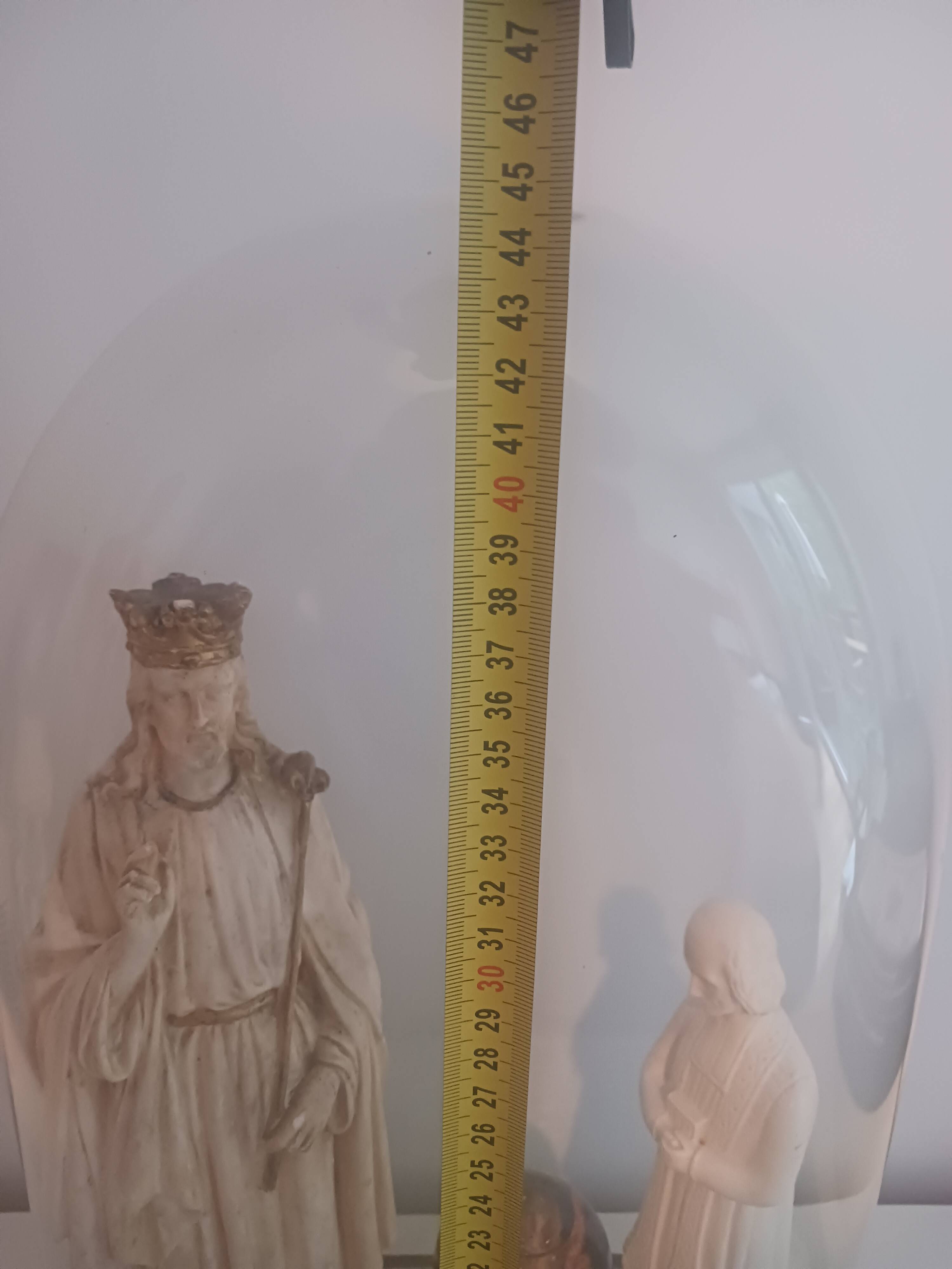 glass cloche with ancient religious statues – Christ King Pier