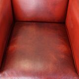 Set of 2 red-colored design armchairs made of sheepskin leather