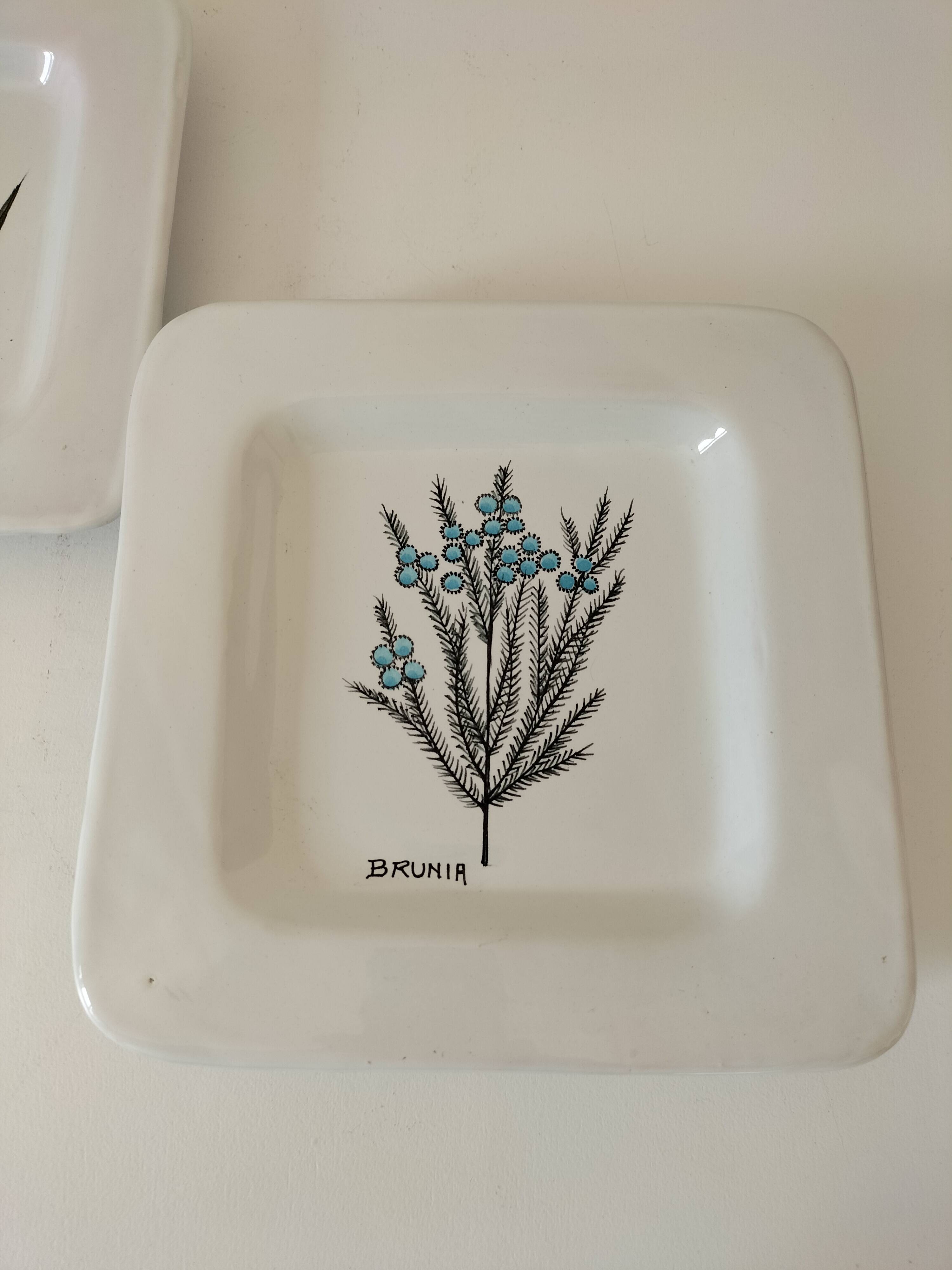 Trio of square Deruta plates signed MARI E.C., botanical decoration 962.21