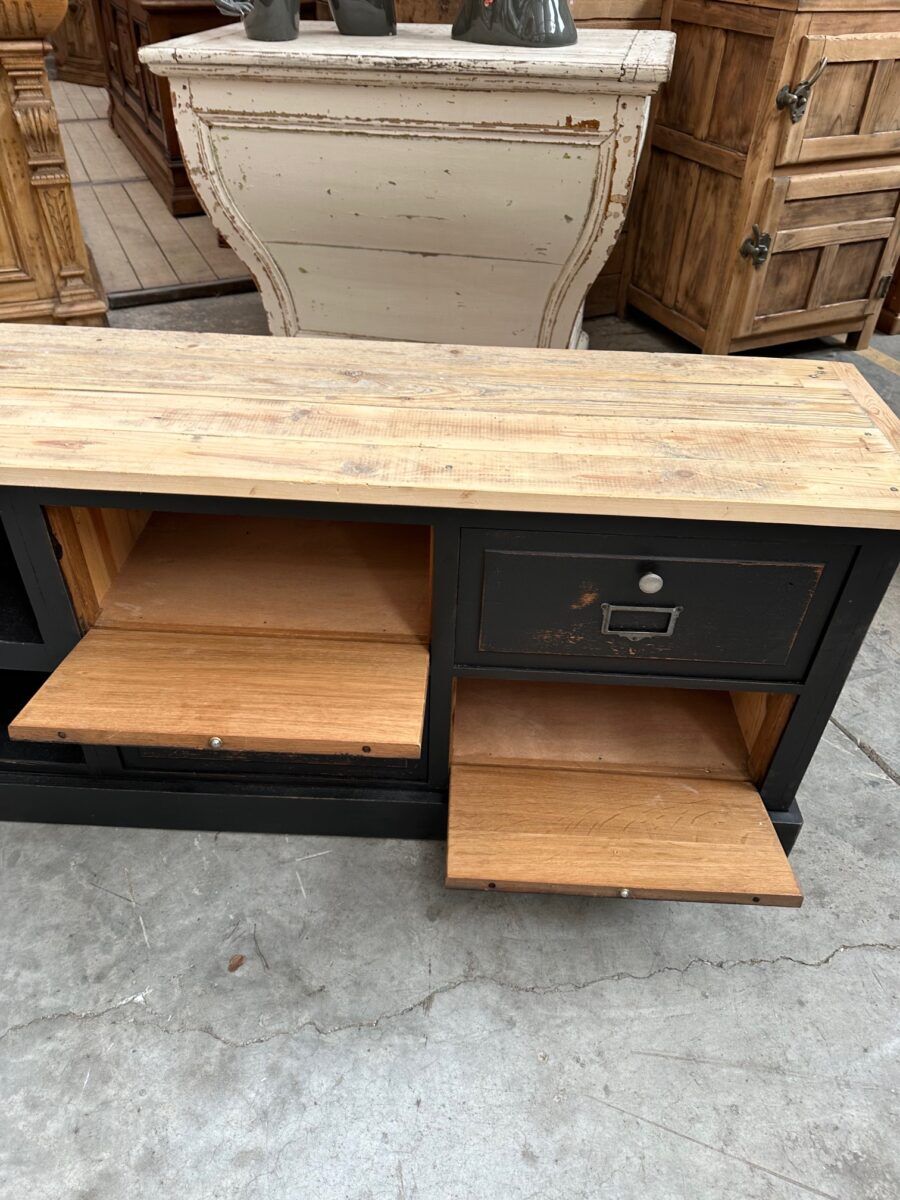Old workshop furniture transformed into a TV unit.