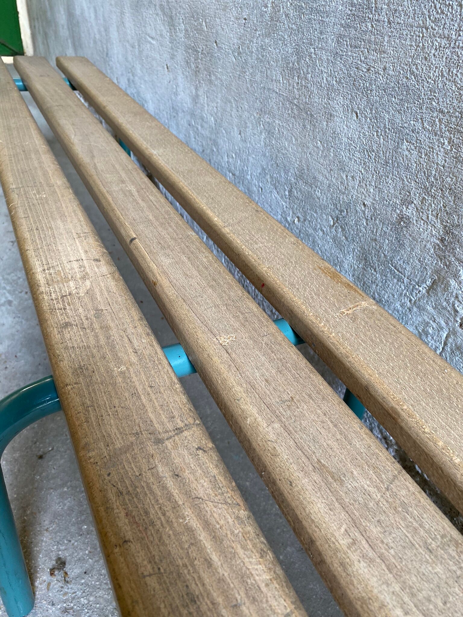 Vintage wood kindergarten bench and tubular structure in long