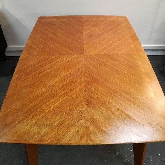 Dining table with compass feet