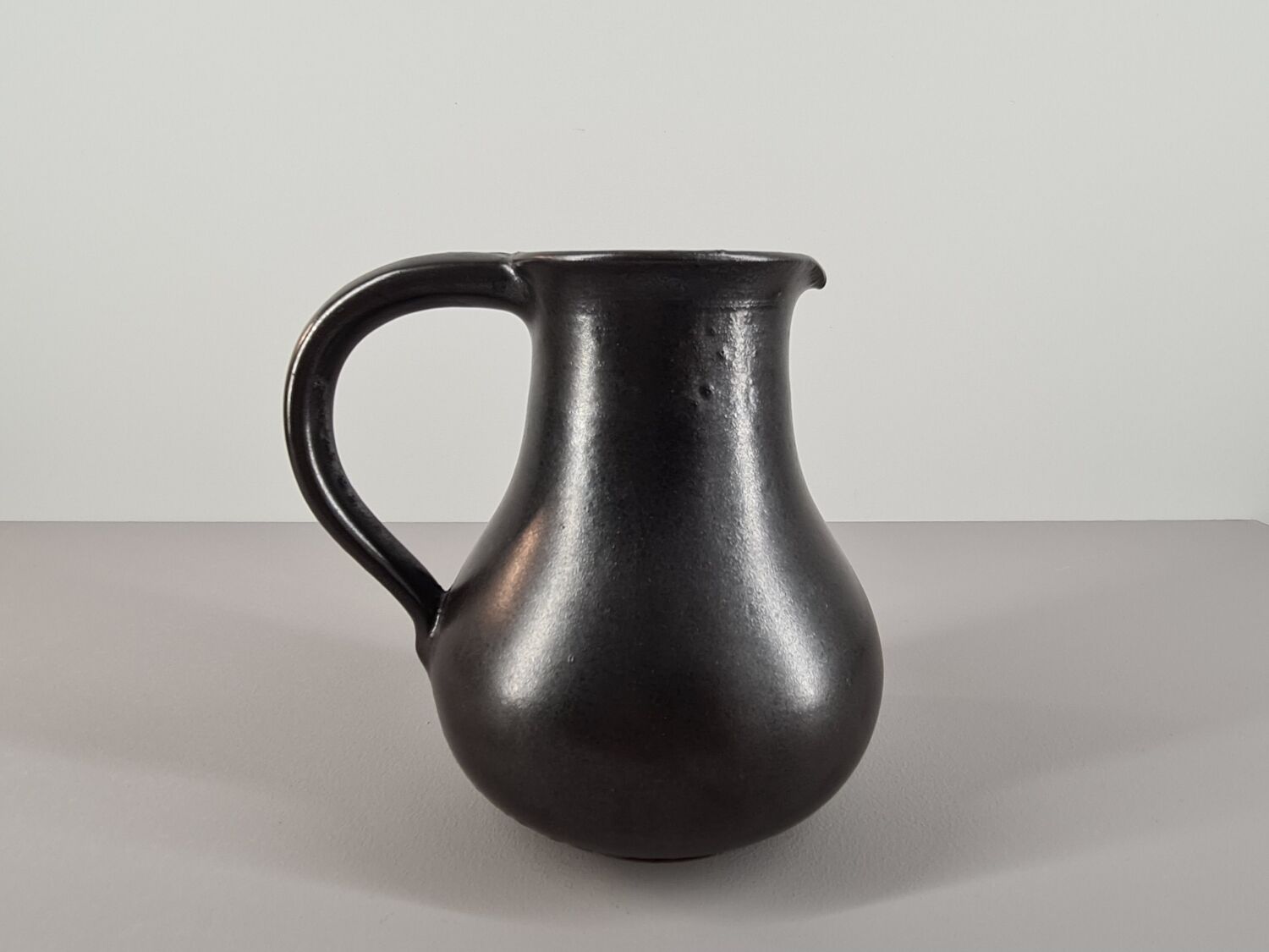 Modernist pitcher in black ceramic 50s