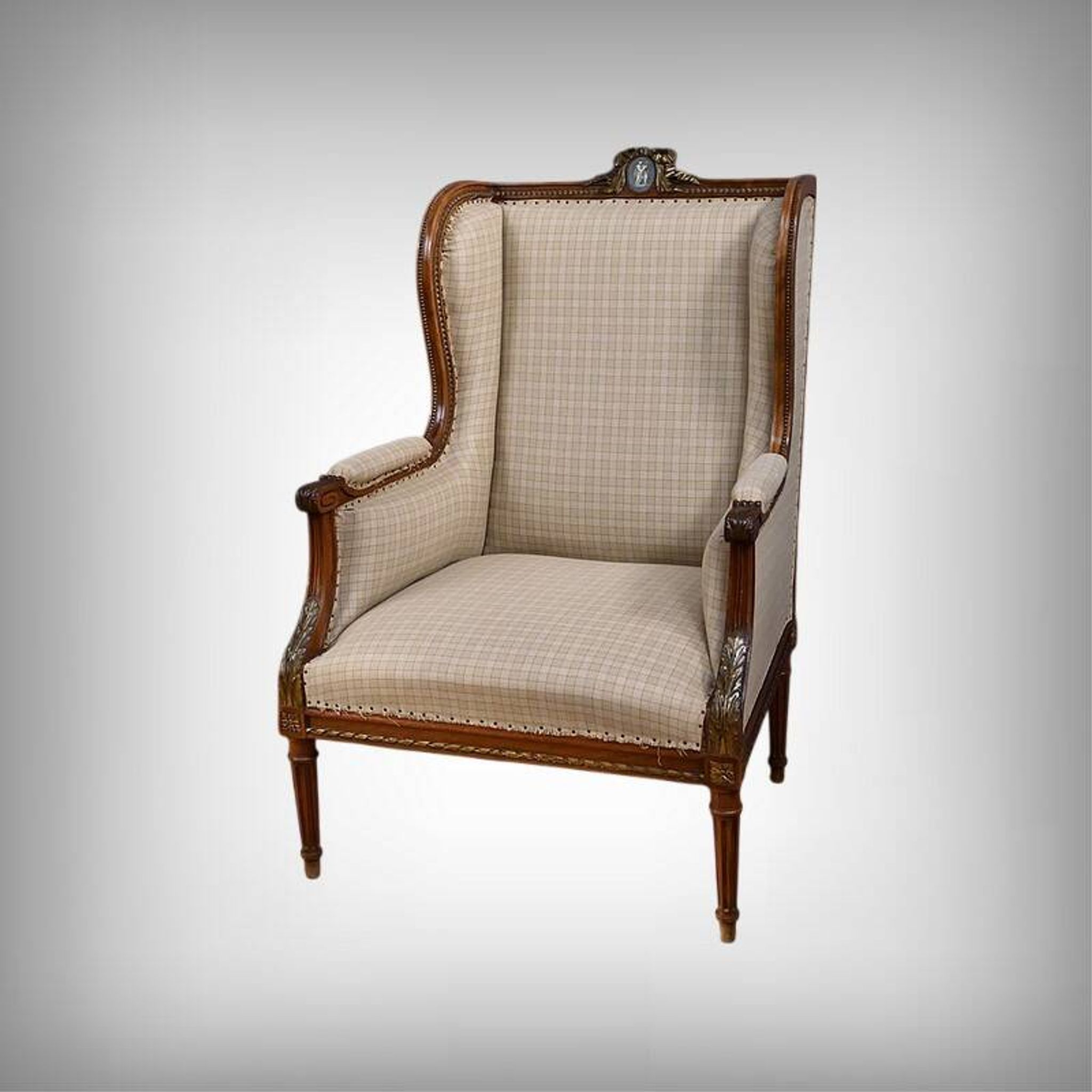 Wingback armchair in walnut, Louis XVI style – late 19th century
