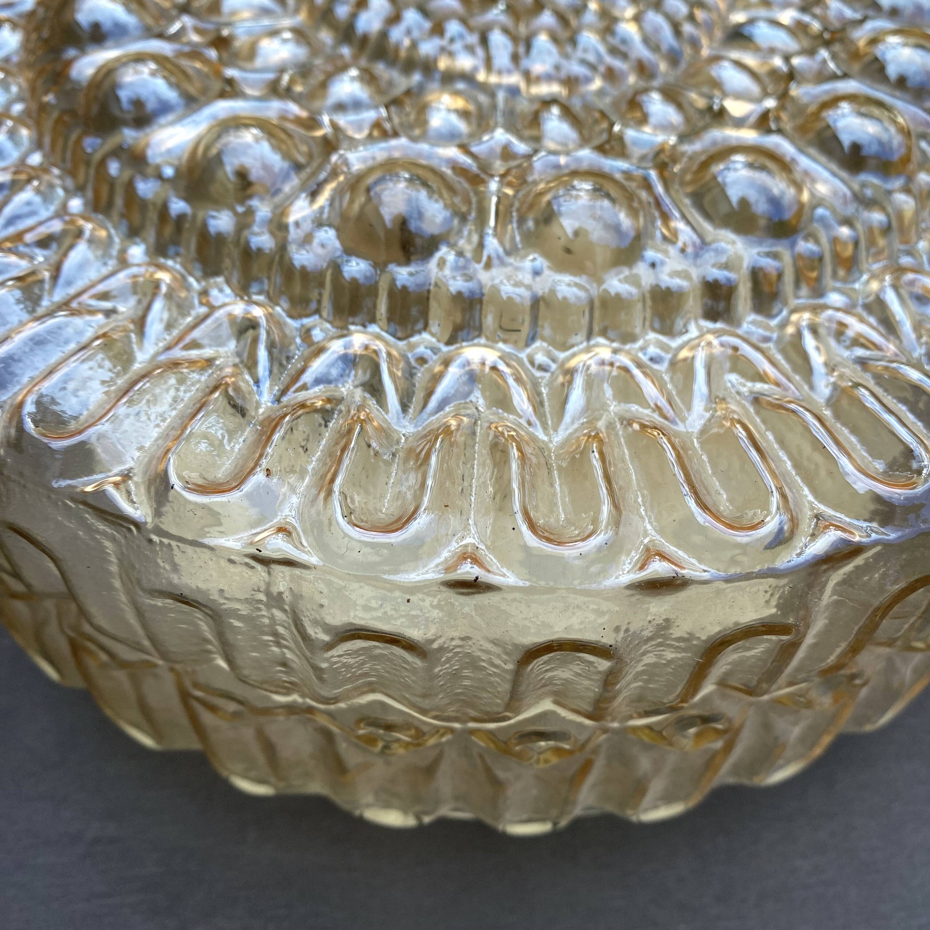 Vintage round ceiling light in amber glass