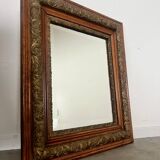Old mirror in oak and gilded wood early 20th century beveled glass
