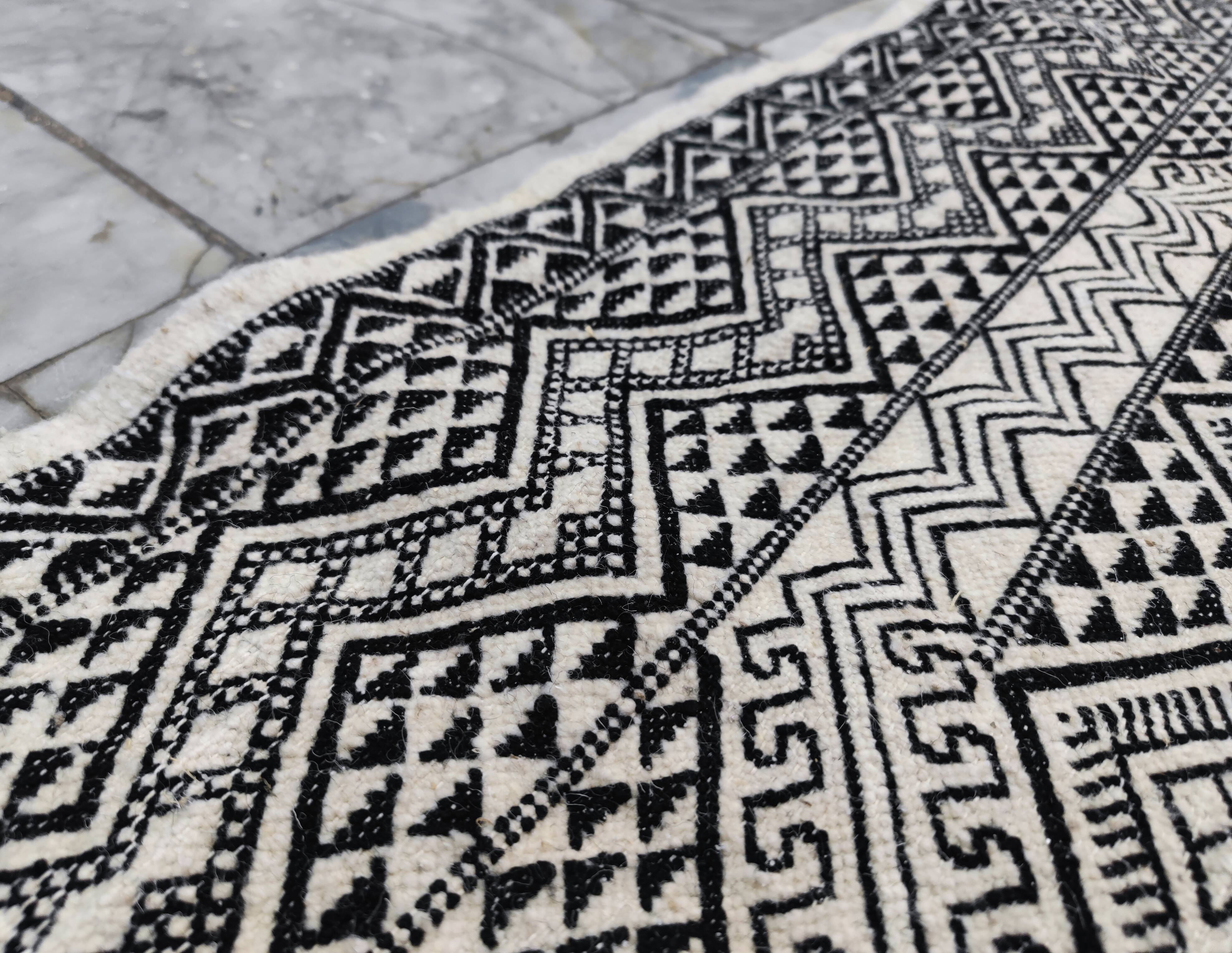 Handwoven black and white rug
