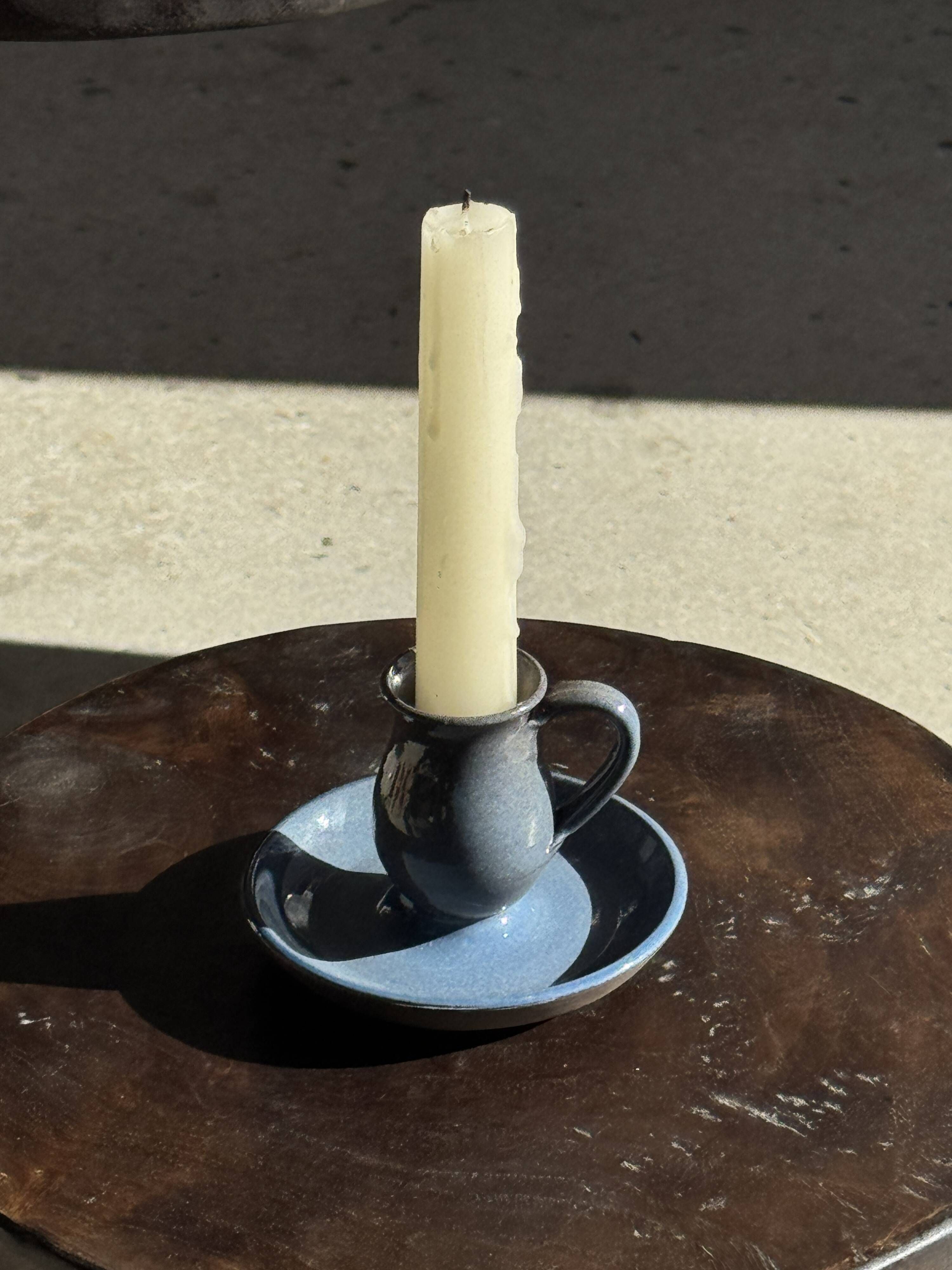 Vintage hand-held candlestick in blue glazed stoneware with floral decoration by Poterie Millian.