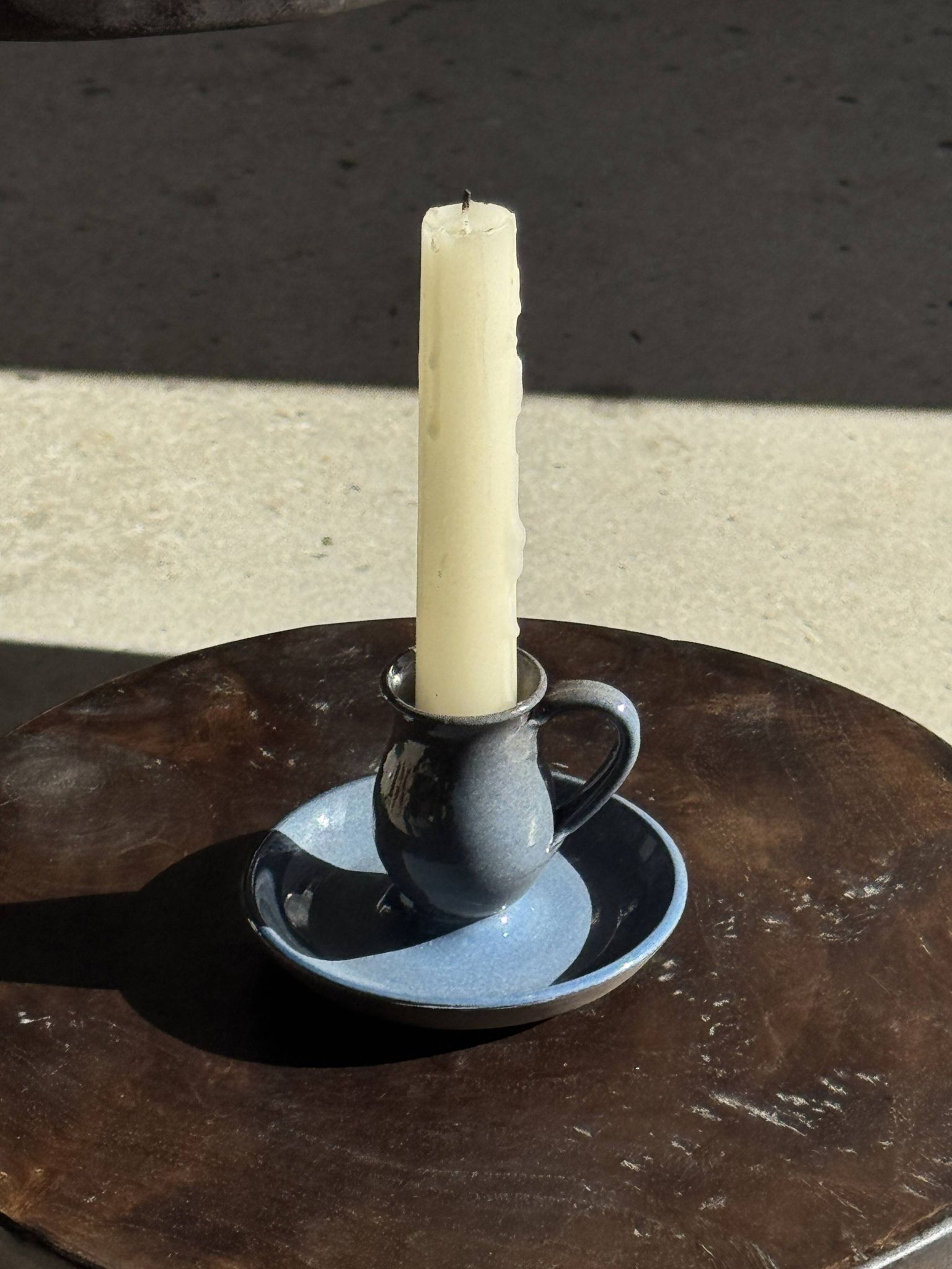 Vintage hand-held candlestick in blue glazed stoneware with floral decoration by Poterie Millian.