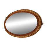 Antique oval mirror with beveled glass in wood and stucco, 19th century