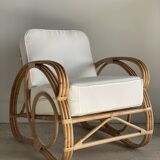 Large rattan rest chair and white cushions