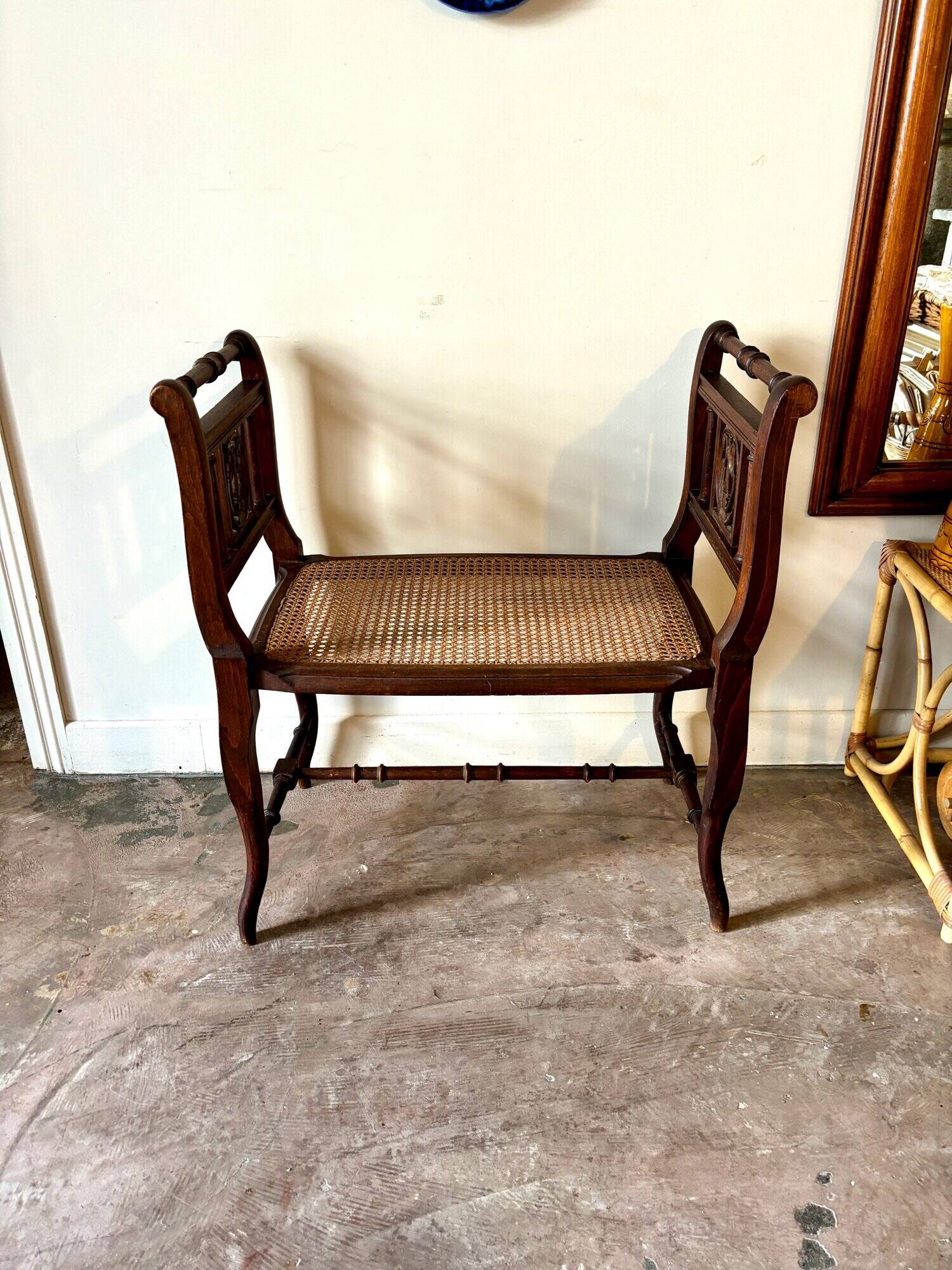 Dark wood and cane bench