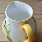 Vintage earthenware and slip pitcher with lemon motif