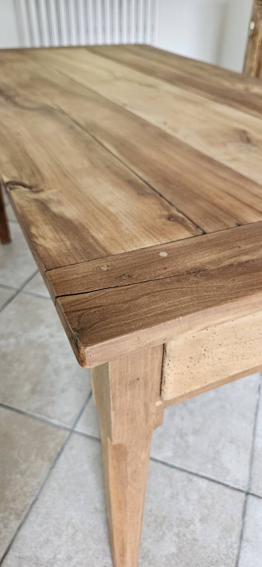 Old farmhouse table made of solid walnut wood.