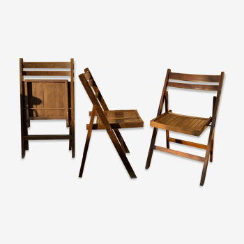 Three wooden folding chairs