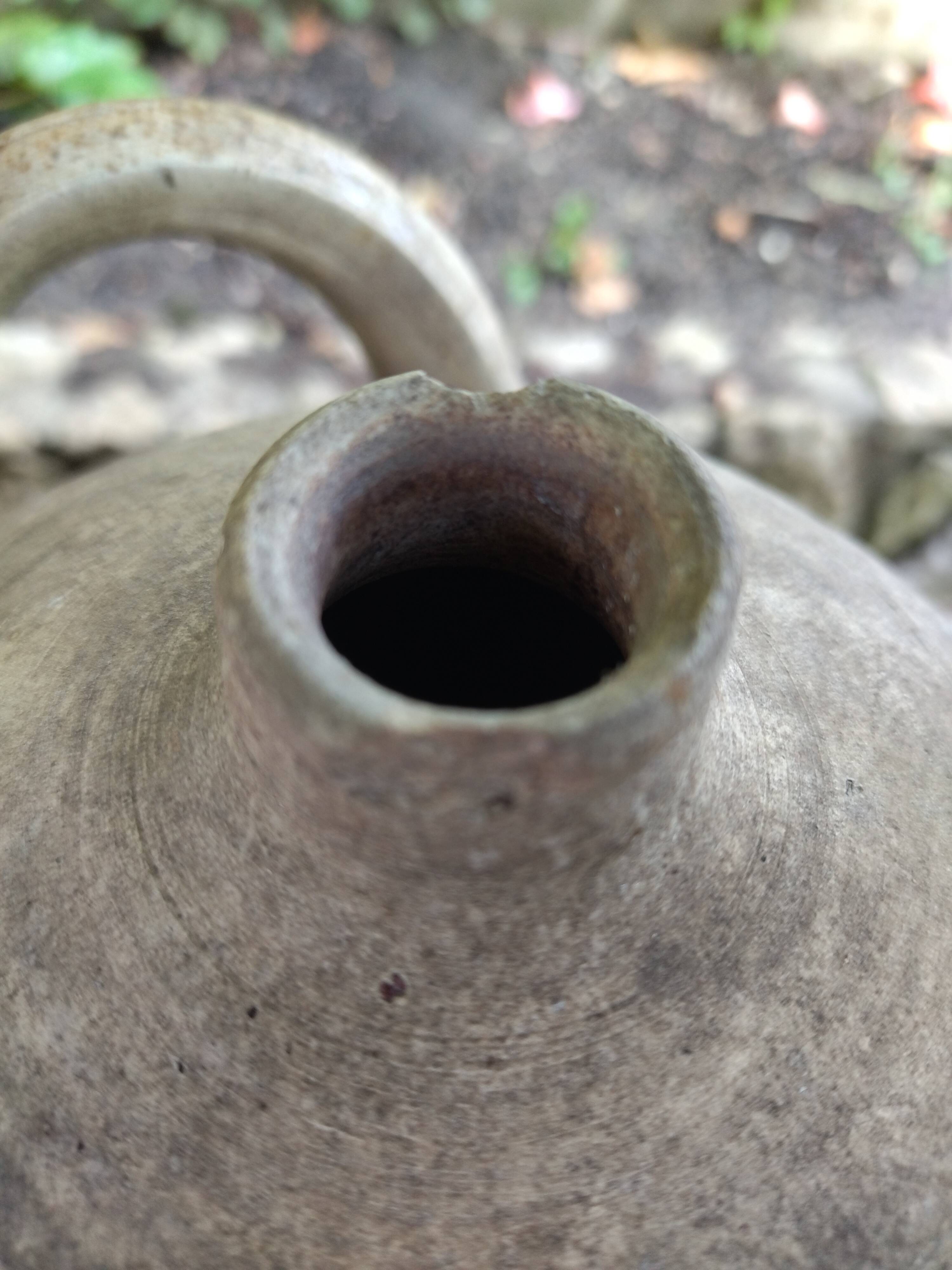 Ancient sandstone jar with two handles