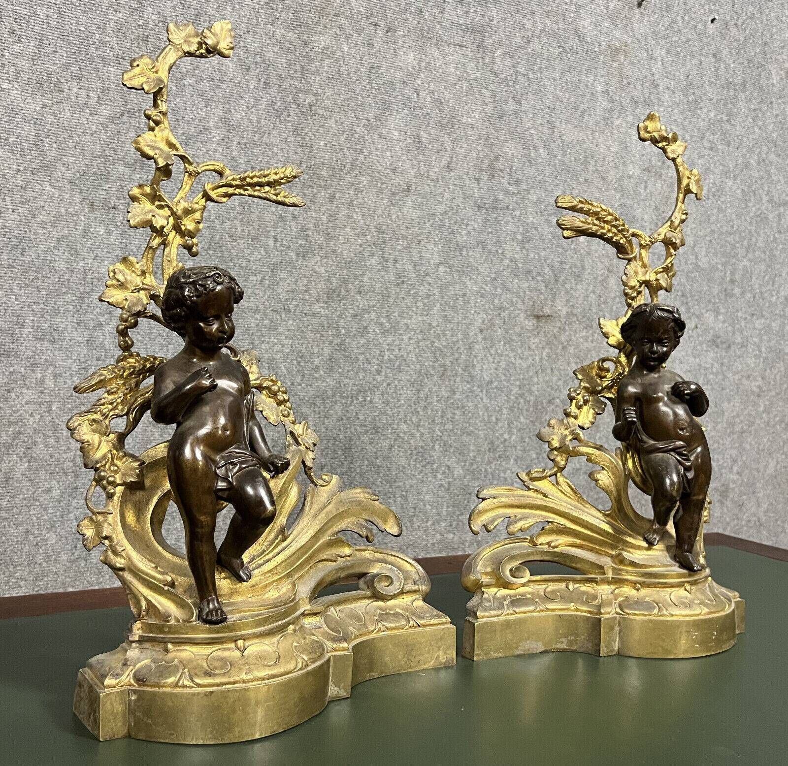 Pair of gilded bronze and patinated bronze andirons depicting putti circa 1850