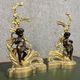 Pair of gilded bronze and patinated bronze andirons depicting putti circa 1850