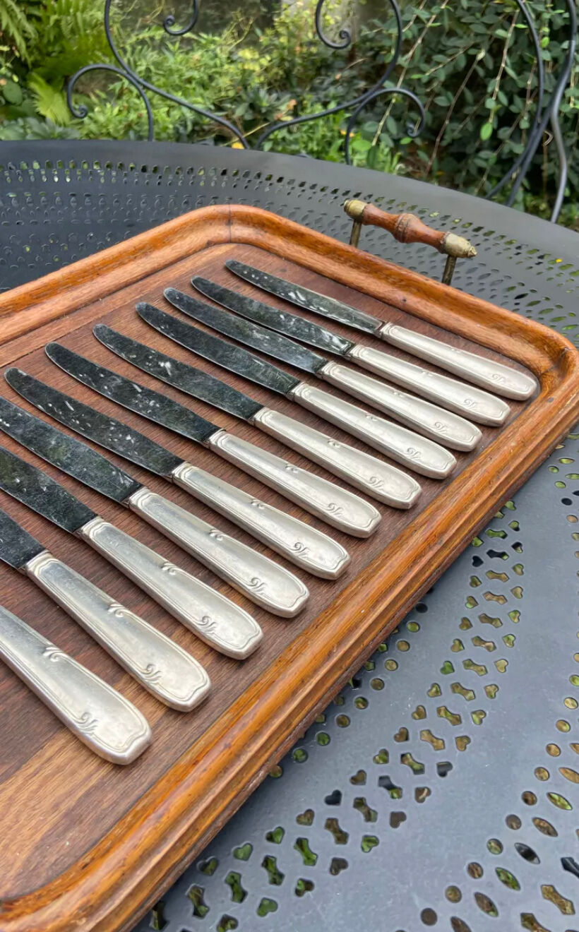 Set of 11 large silver metal knives