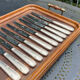 Set of 11 large silver metal knives