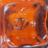 2 amber glass bottles with their old labels