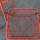 4 red 70s chairs