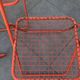 4 red 70s chairs