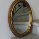 Oval gold mirror in Napoléon III style