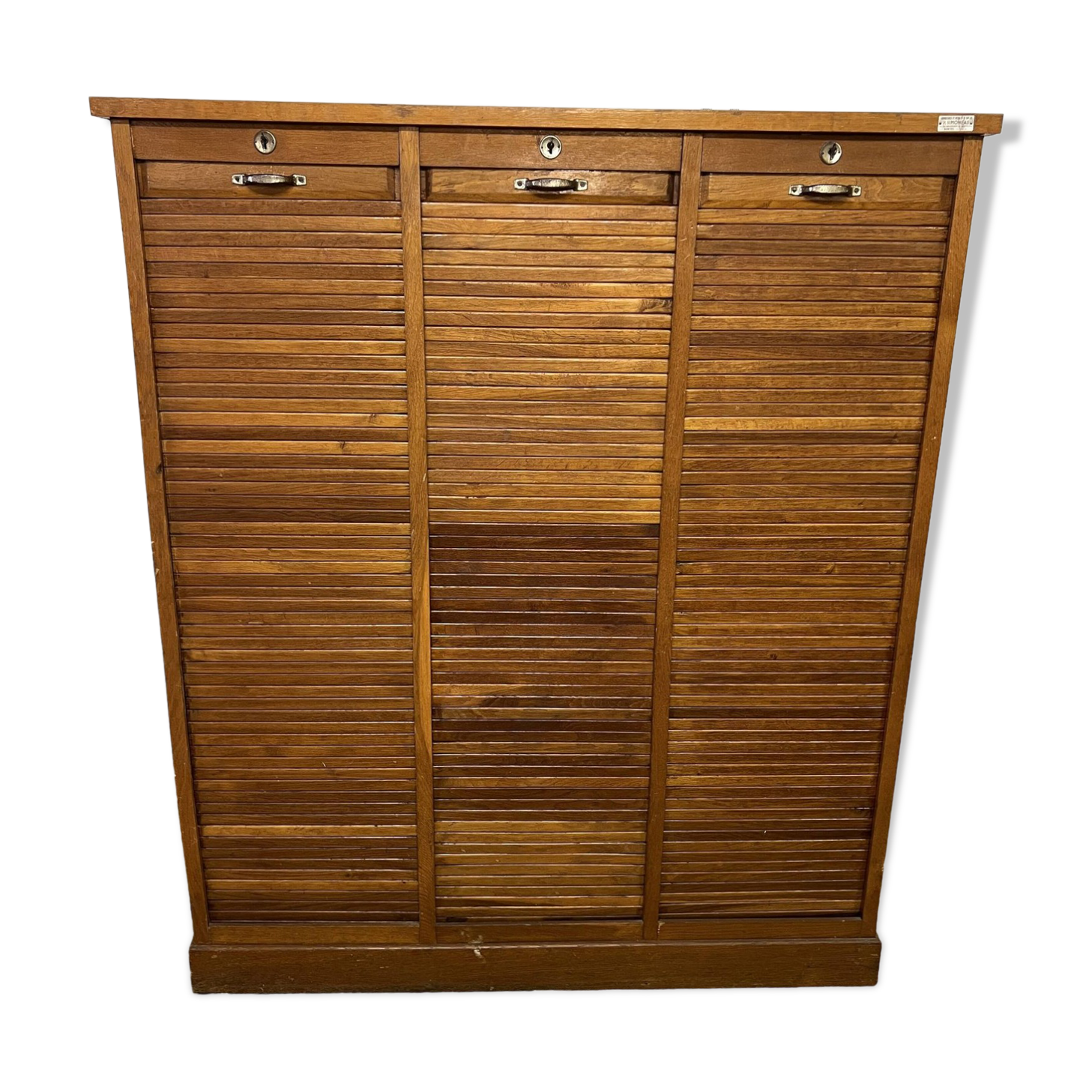 Old filing cabinet with triple curtains