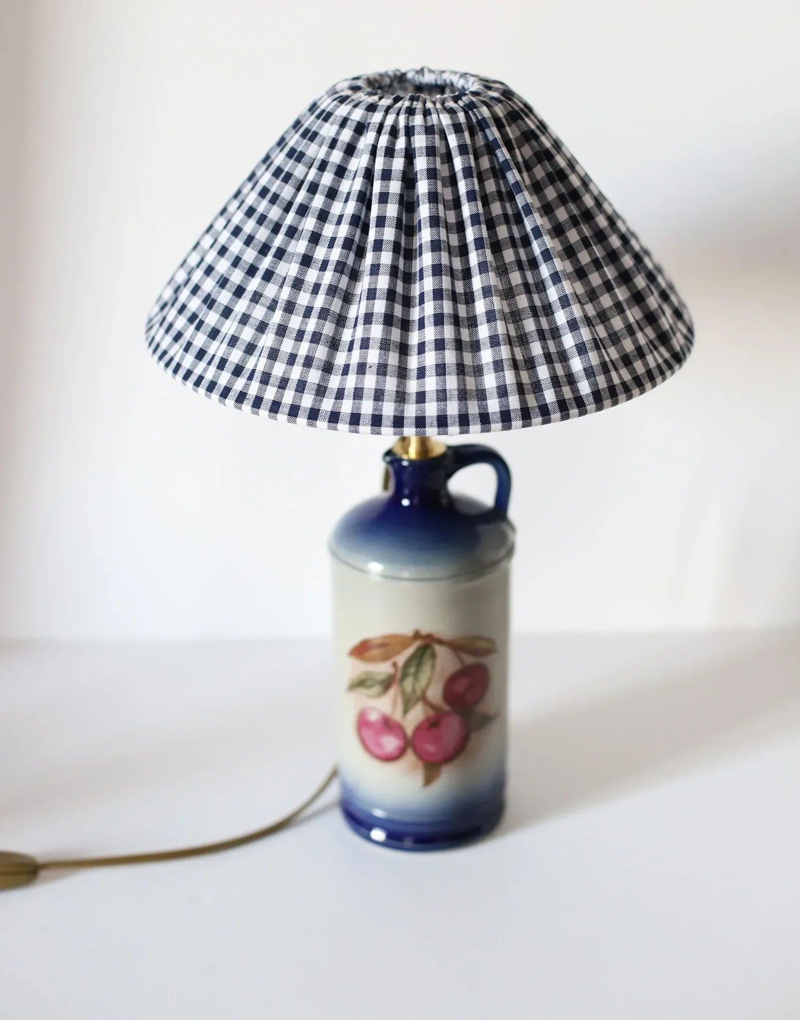 Vintage table lamp Hautlalampe: blue Alsace stone base and pleated Vichy shade.