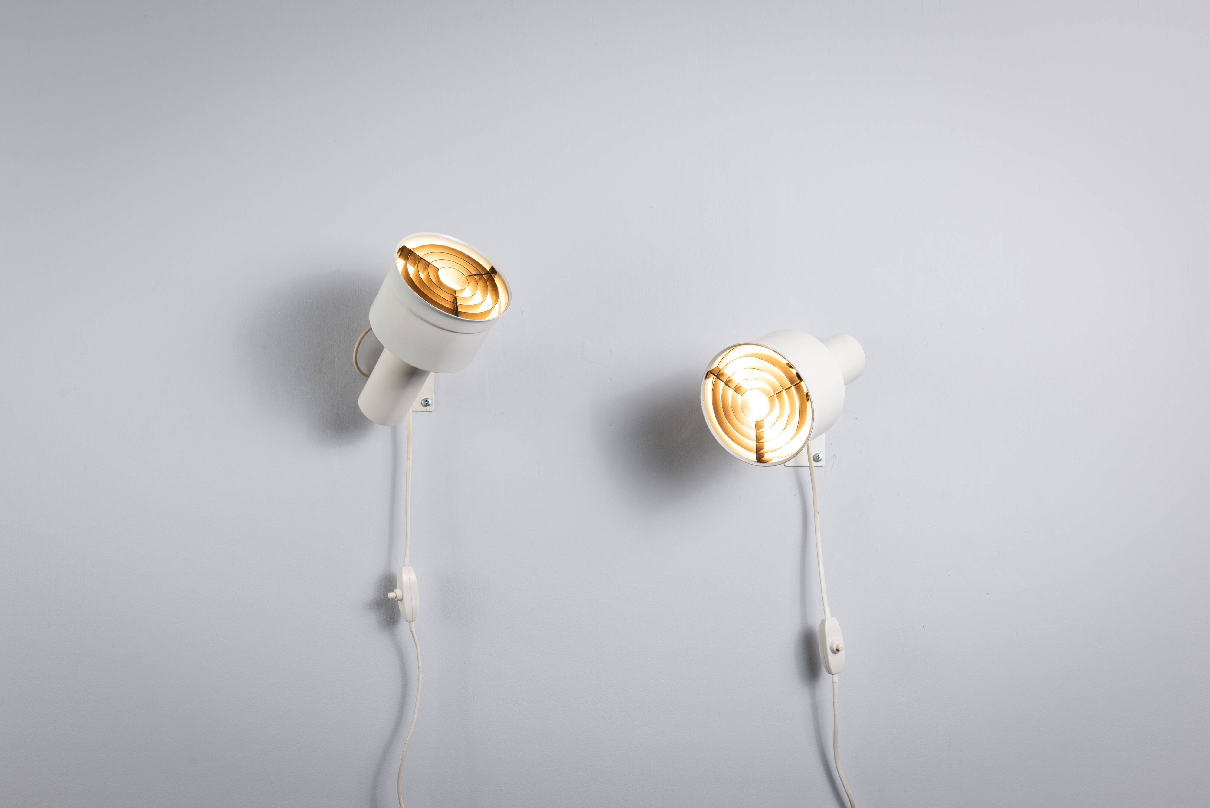 Pair of adjustable wall lamps designed by Per Sundstedt for Kosta Lampan