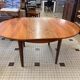 Table ronde en bois avec rallonges intégrées