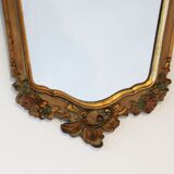 Old mirror gilded wooden frame and polychrome décor.