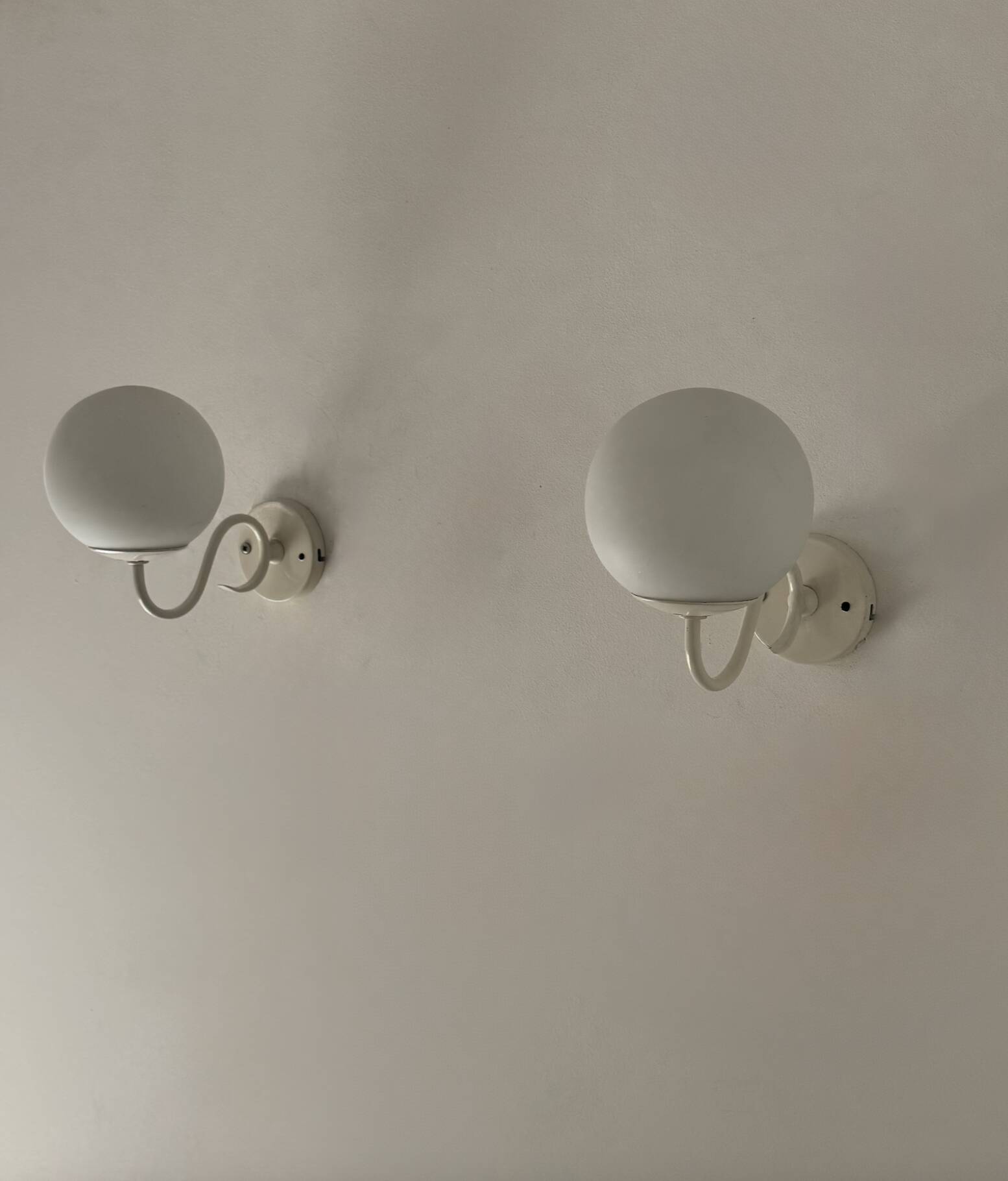 Pair of vintage metal and opaline wall lights, France, 1980.