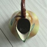 Ceramic pitcher in the shape of a slip pear.