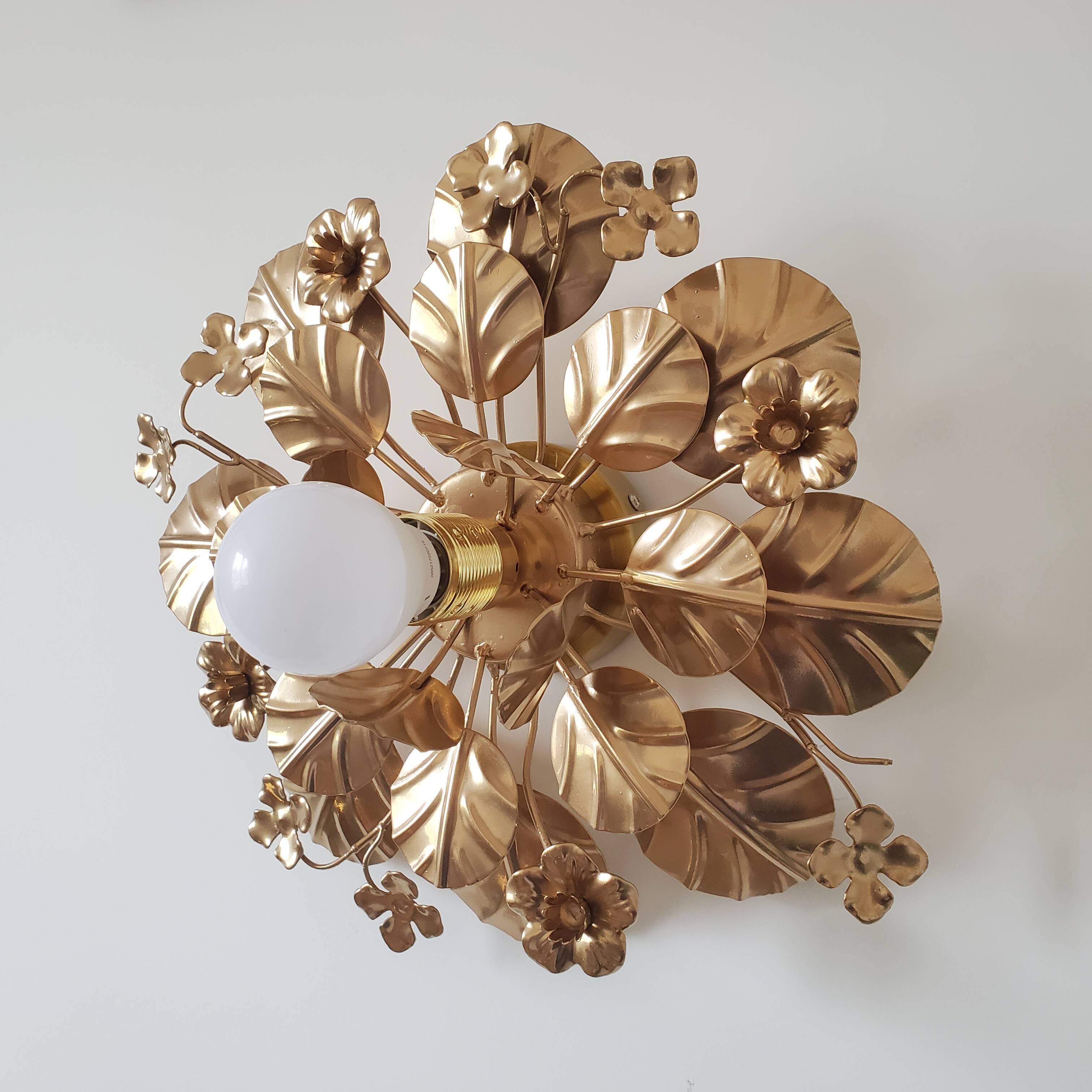 Golden metal flower sconces
