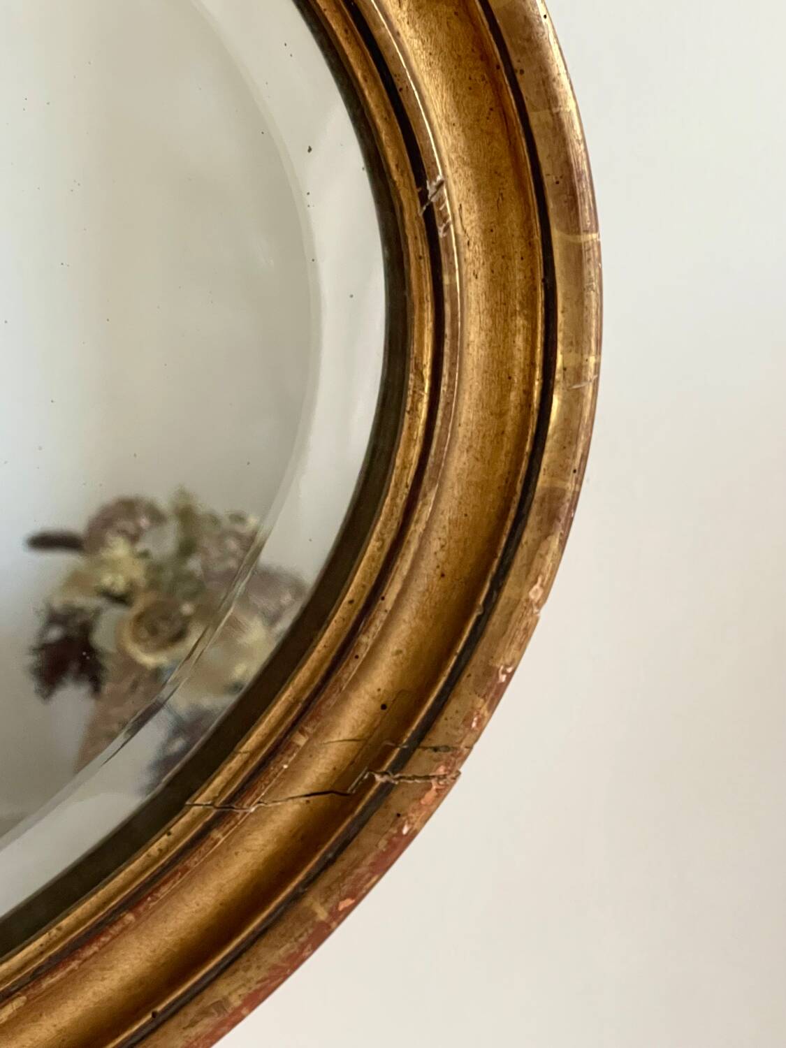 Antique oval gilt mirror.