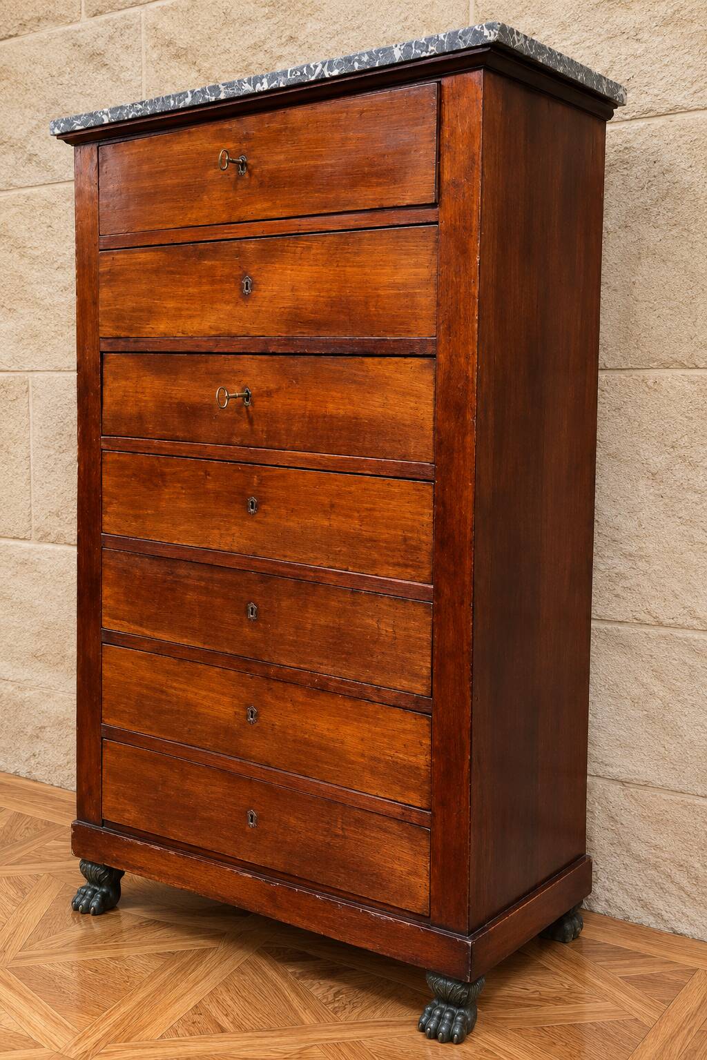Empire Restoration period chest of drawers in mahogany, with a marble top.